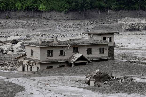 A mud-covered building following a flash flood at Trishuli, Nepal
