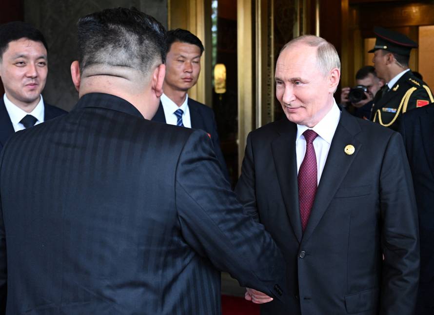 Russian President Vladimir Putin meets with North Korean leader Kim Jong Un in Beijing