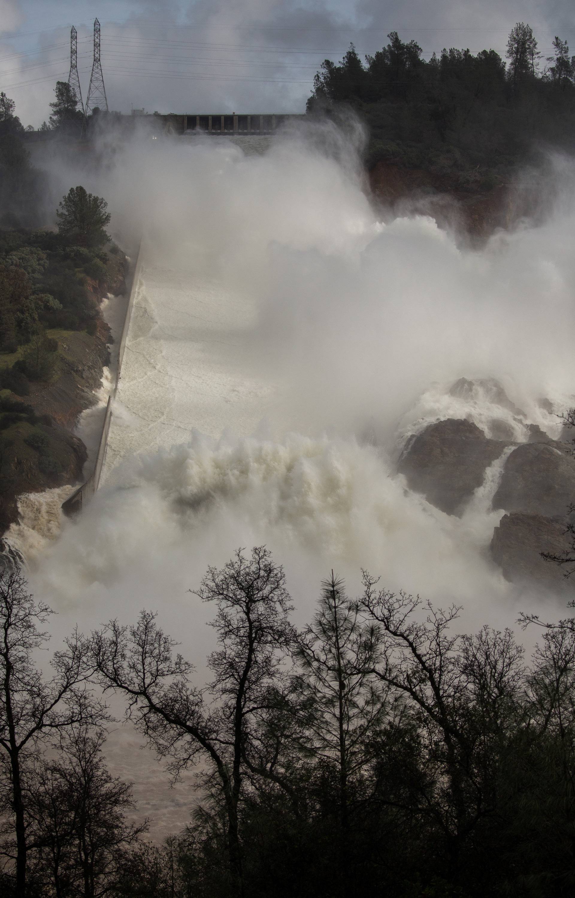 65,000 cfs of water flows through a damaged spillway on the Oroville Dam in Oroville, California