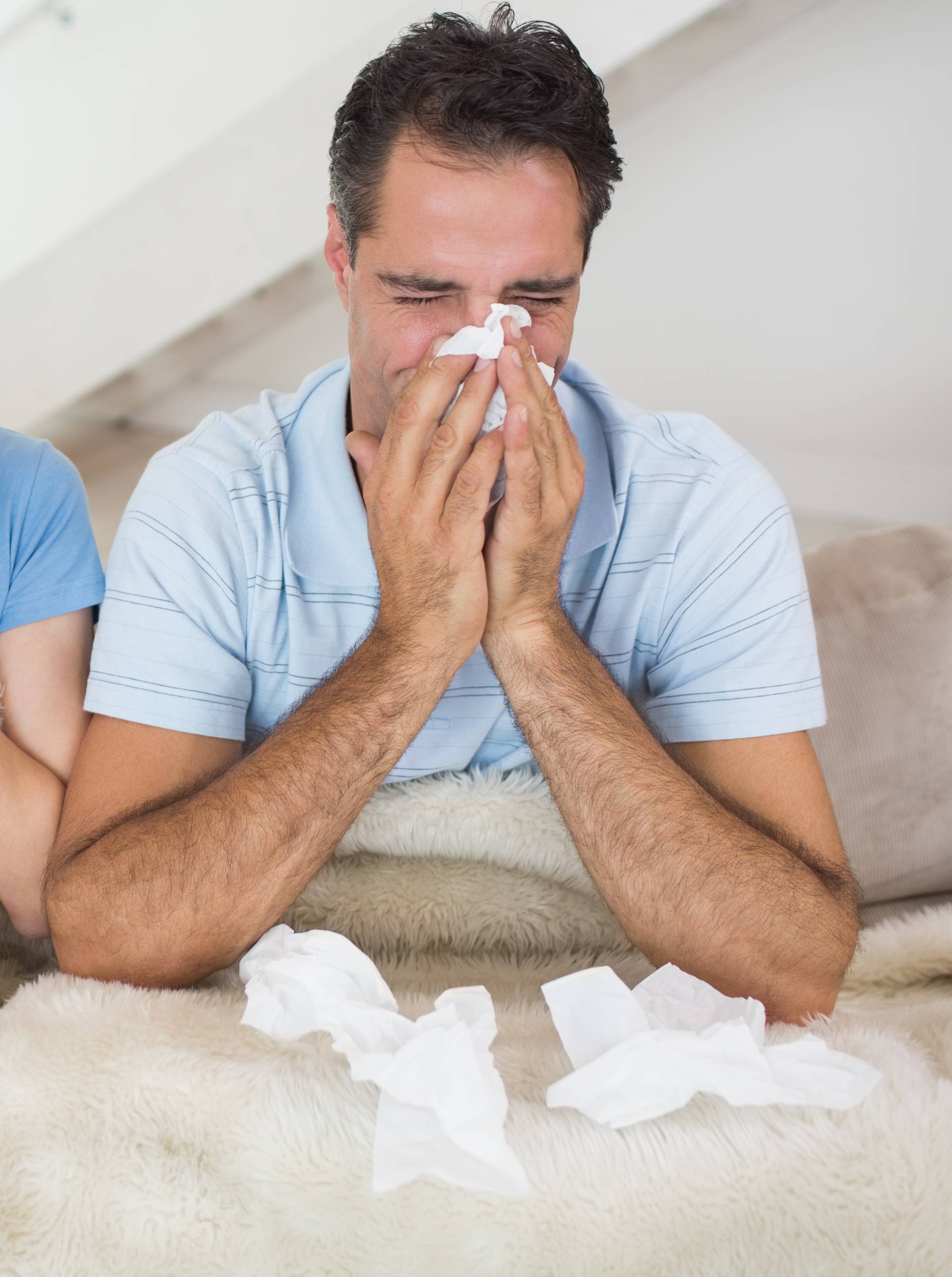 Couple suffering from cold in bed