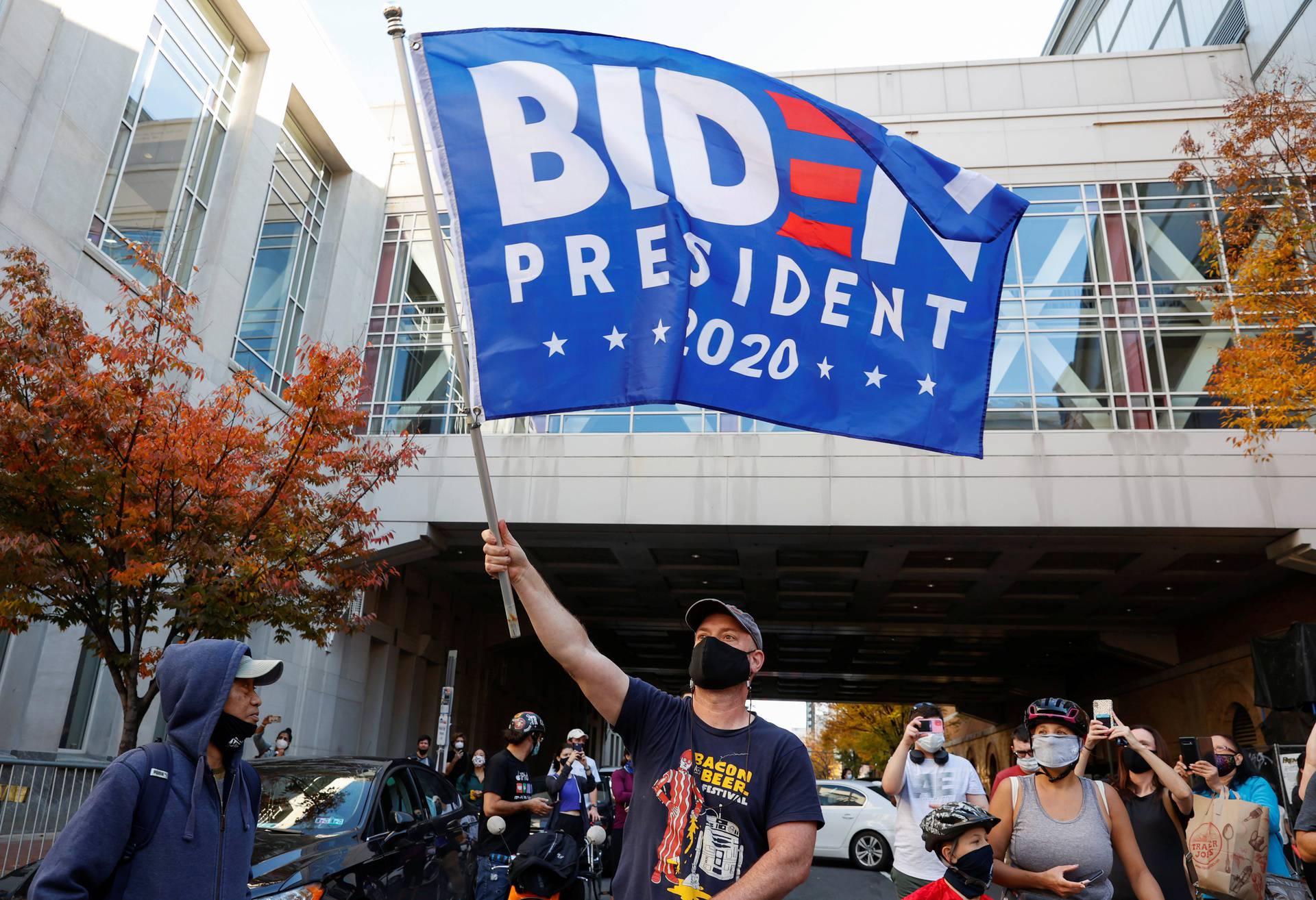 People react as media announce that Democratic U.S. presidential nominee Joe Biden has won the 2020 U.S. presidential election, in, Philadelphia