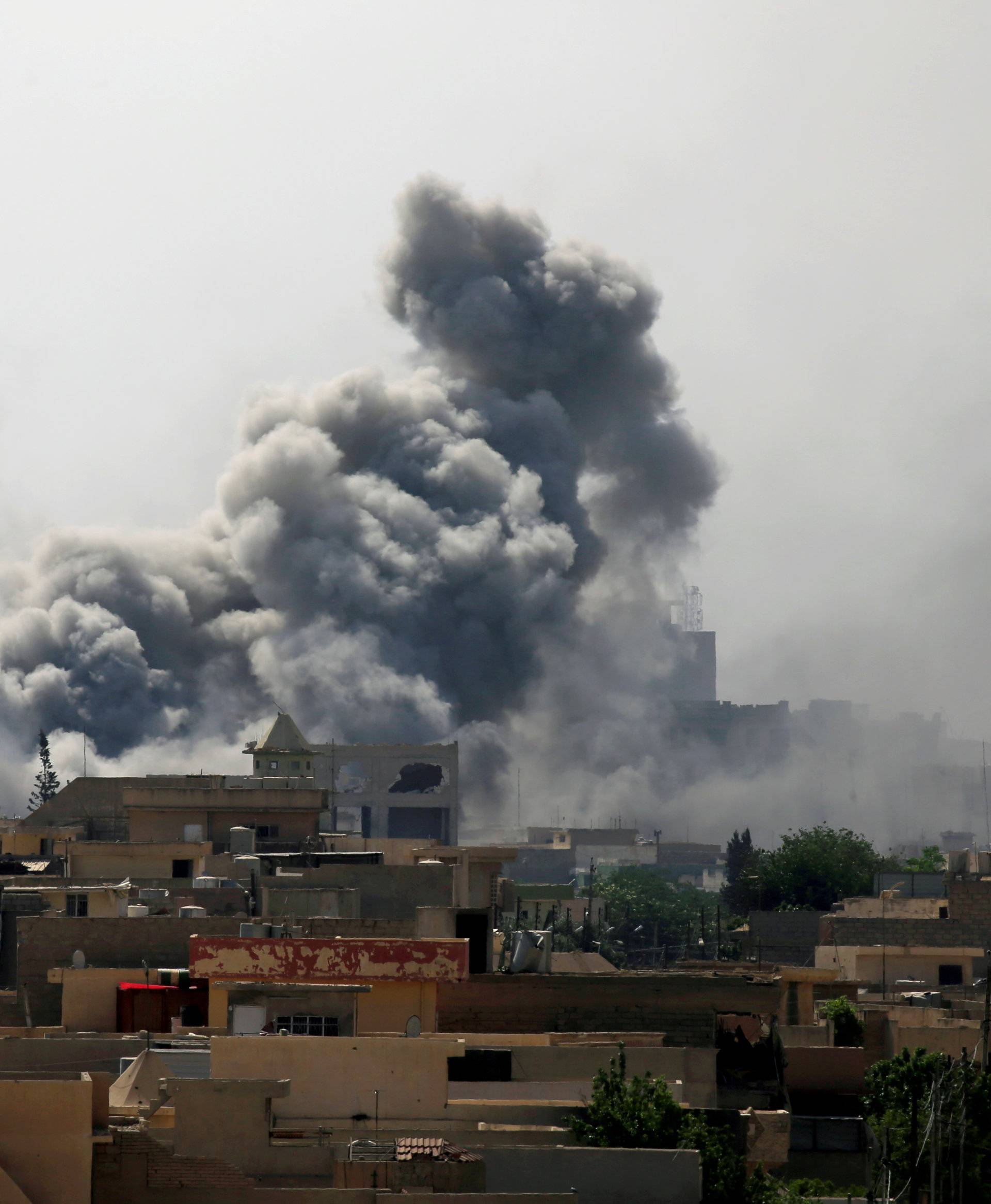 FILE PHOTO: Smoke rises from an airstrike during a battle between Iraqi forces and Islamic State militants in western Mosul