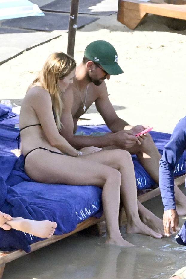 *EXCLUSIVE* Serbian tennis player Novak Djokovic and his Wife Jelena Pack on the PDA during a Family Beach Day at Nammos Beach in Mykonos.