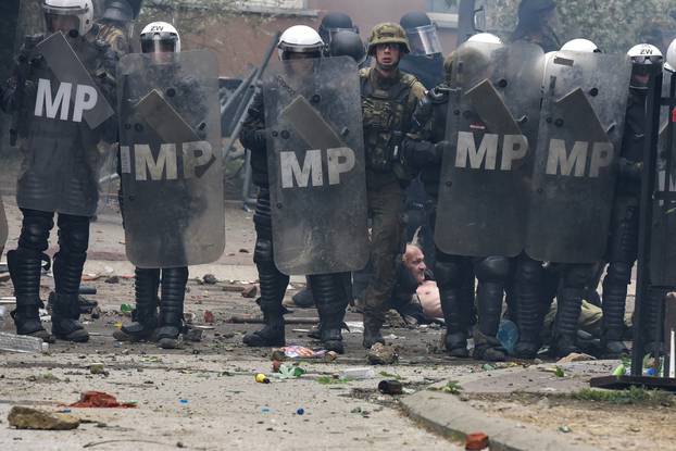 NATO Kosovo Force (KFOR) soldiers clash with local Kosovo Serb protesters in the town of Zvecan