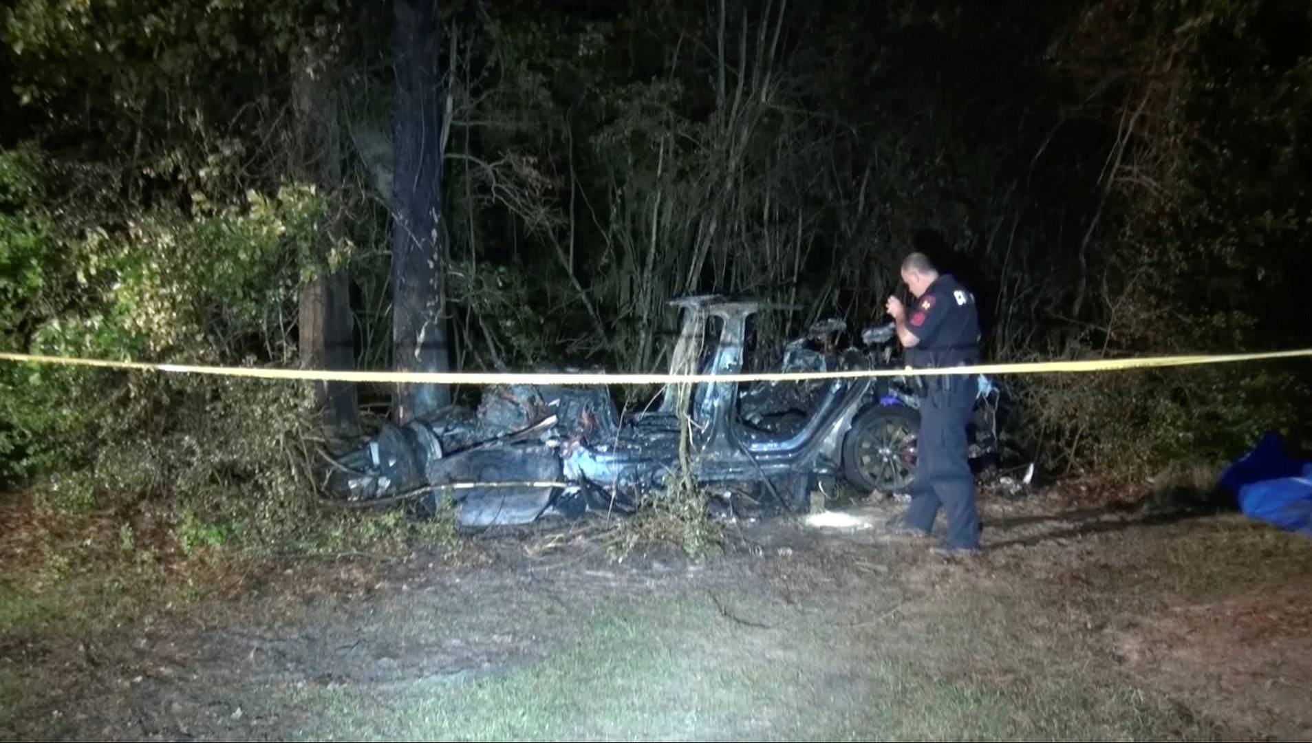 The remains of a Tesla vehicle are seen after it crashed in The Woodlands, Texas