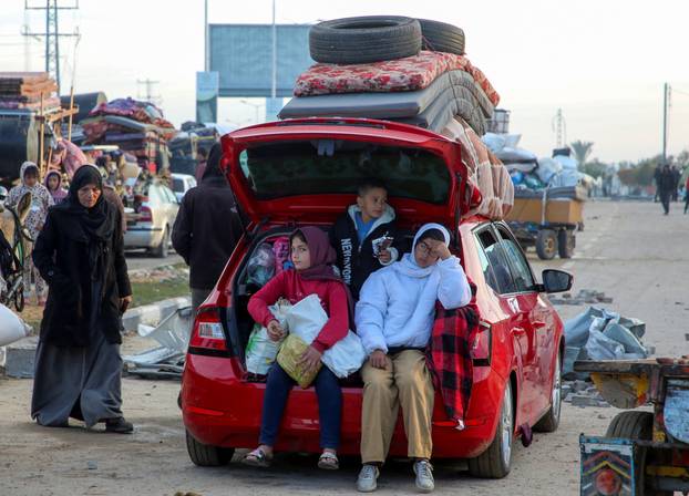 Displaced Palestinians wait to be allowed to return to their homes in northern Gaza, in the central Gaza Strip