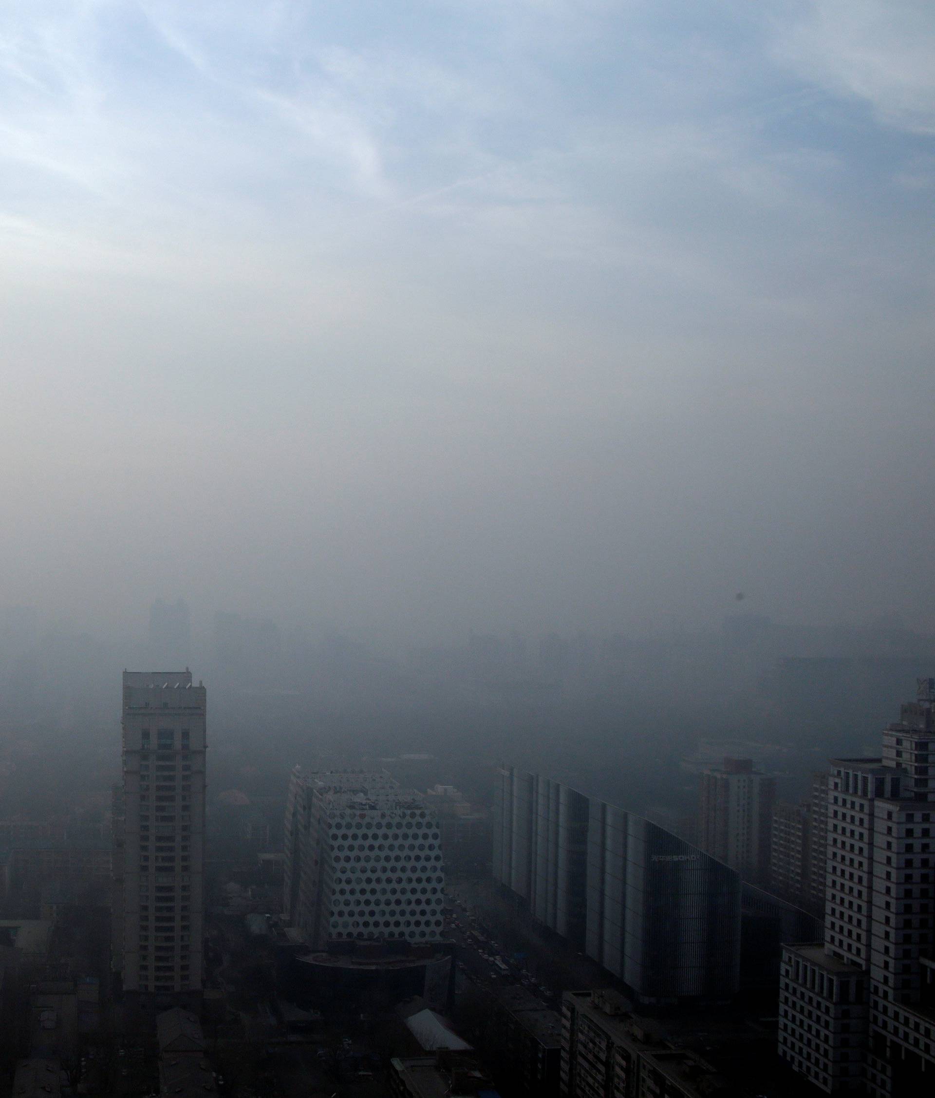 Buildings are seen in smog on a polluted day in Beijing