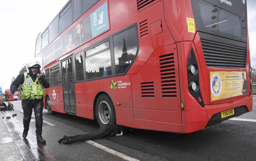 A woman lies injured after an incident on Westminster Bridge in London