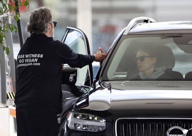 *EXCLUSIVE* Joaquin Phoenix and Rooney Mara are taking no risk with the coronavirus as they stop for gas