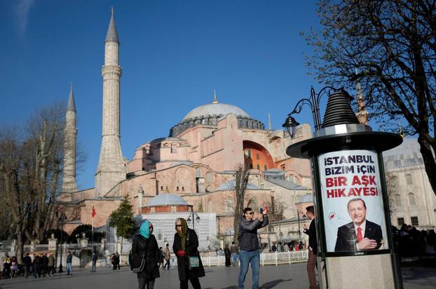 An election banner of Turkish President Tayyip Erdogan, with the Byzantine-era monument of Hagia Sophia in the background, is pictured in Istanbul