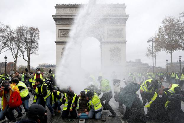 Protesters wearing yellow vests, a symbol of a French drivers