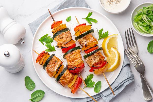 Grilled,Salmon,And,Vegetables,Skewers,On,White,Plate,,Top,View