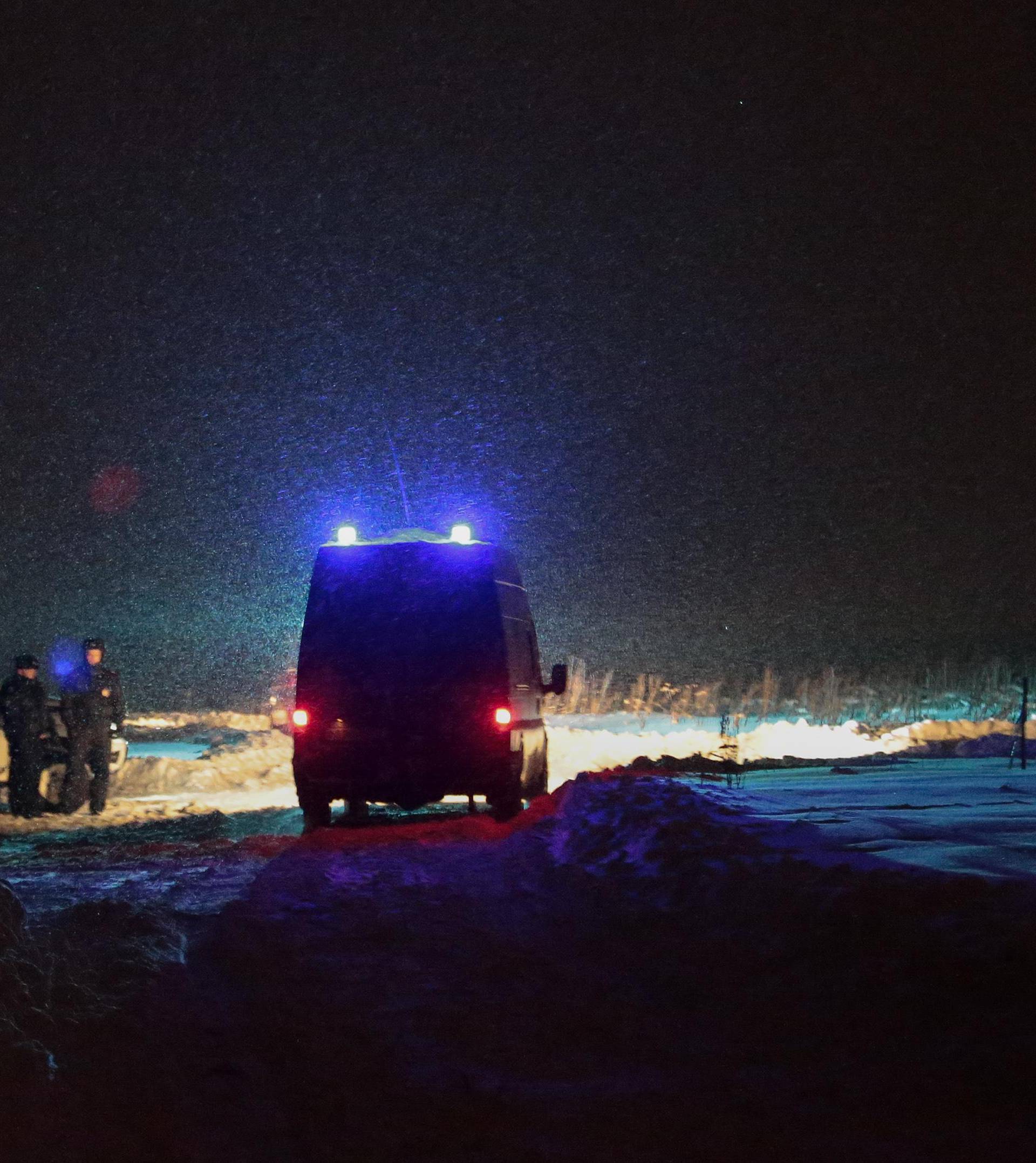 Police officers guard at the scene where a Saratov Airlines Antonov AN-148 plane crashed after taking off from Moscow's Domodedovo airport, outside Moscow