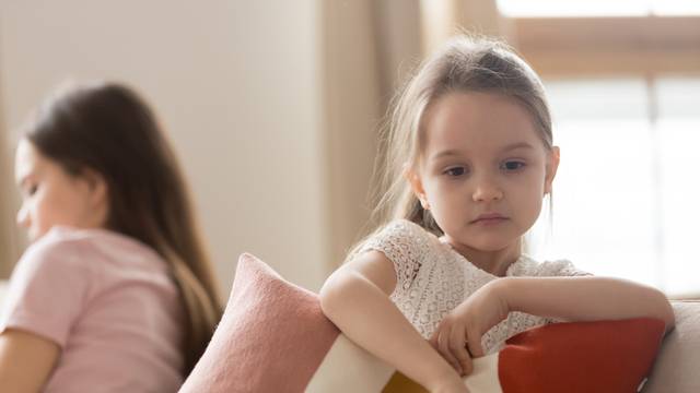 Upset kid daughter feeling sad after fight with mother