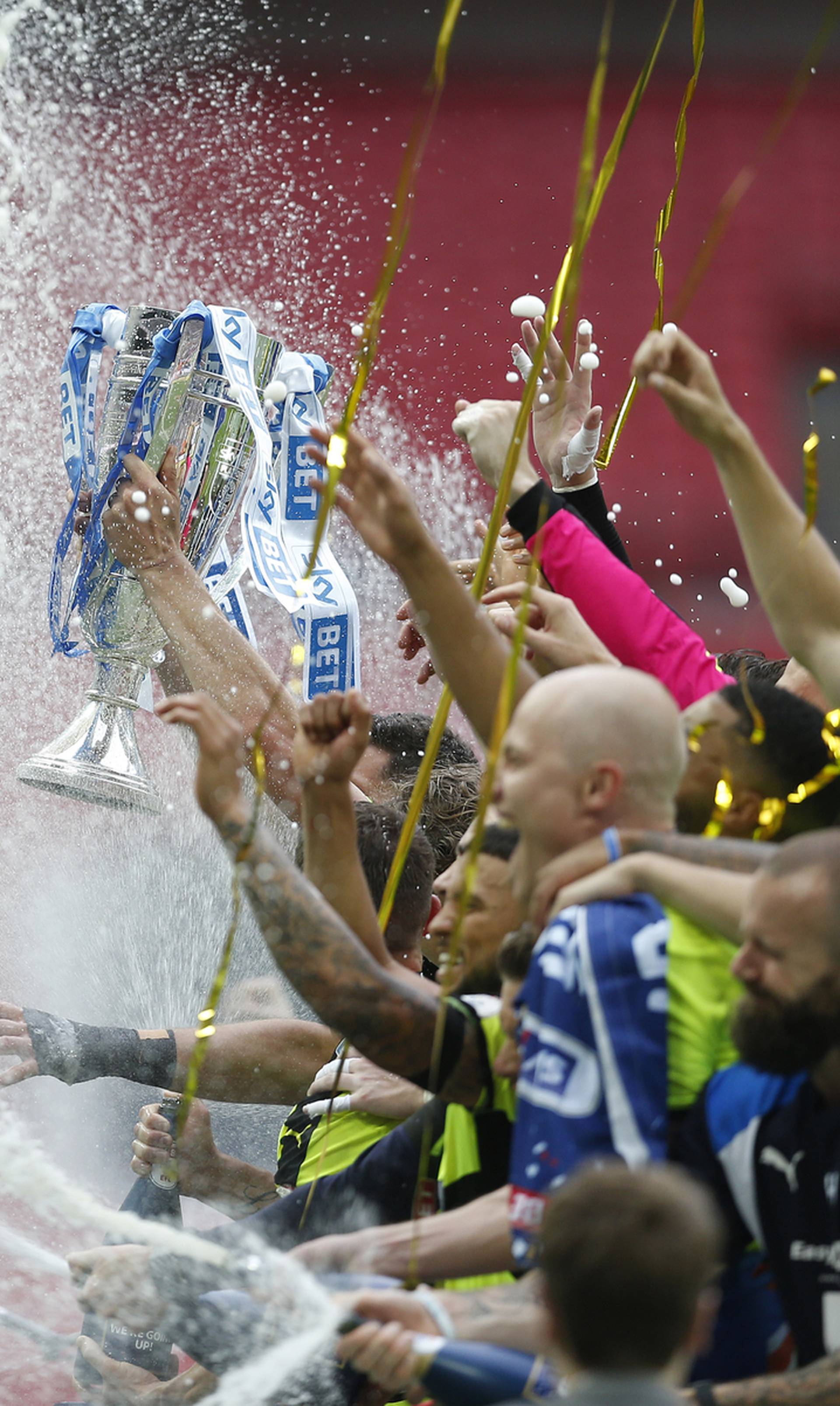 Huddersfield Town celebrate with the trophy after winning the Sky Bet Championship Play-Off Final and getting promoted to the Premier League