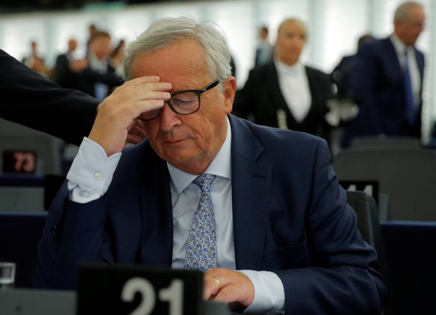 European Commission President Juncker reacts before a debate on The State of the European Union at the European Parliament in Strasbourg