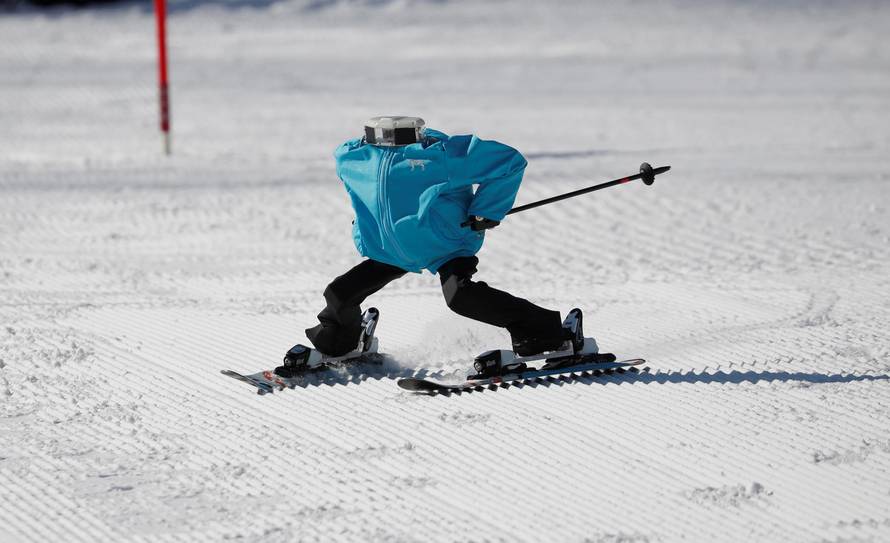 Robot Tae Kwon V skies during the Ski Robot Challenge at a ski resort in Hoenseong