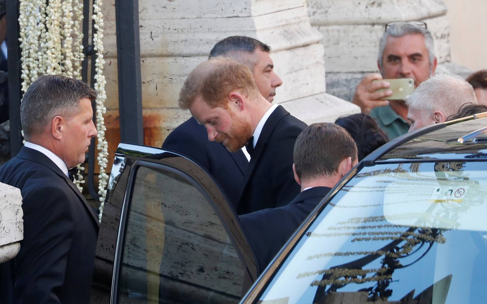 Britain's Prince Harry, Duke of Sussex, arrives to attend the wedding of fashion designer Misha Nonoo at Villa Aurelia in Rome