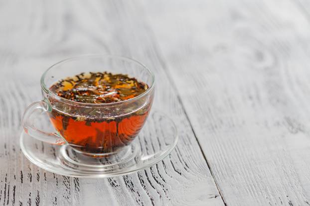 Cup of herbal tea at window still, close up