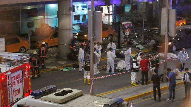 Forensic experts work outside Turkey's largest airport, Istanbul Ataturk, Turkey, following a blast