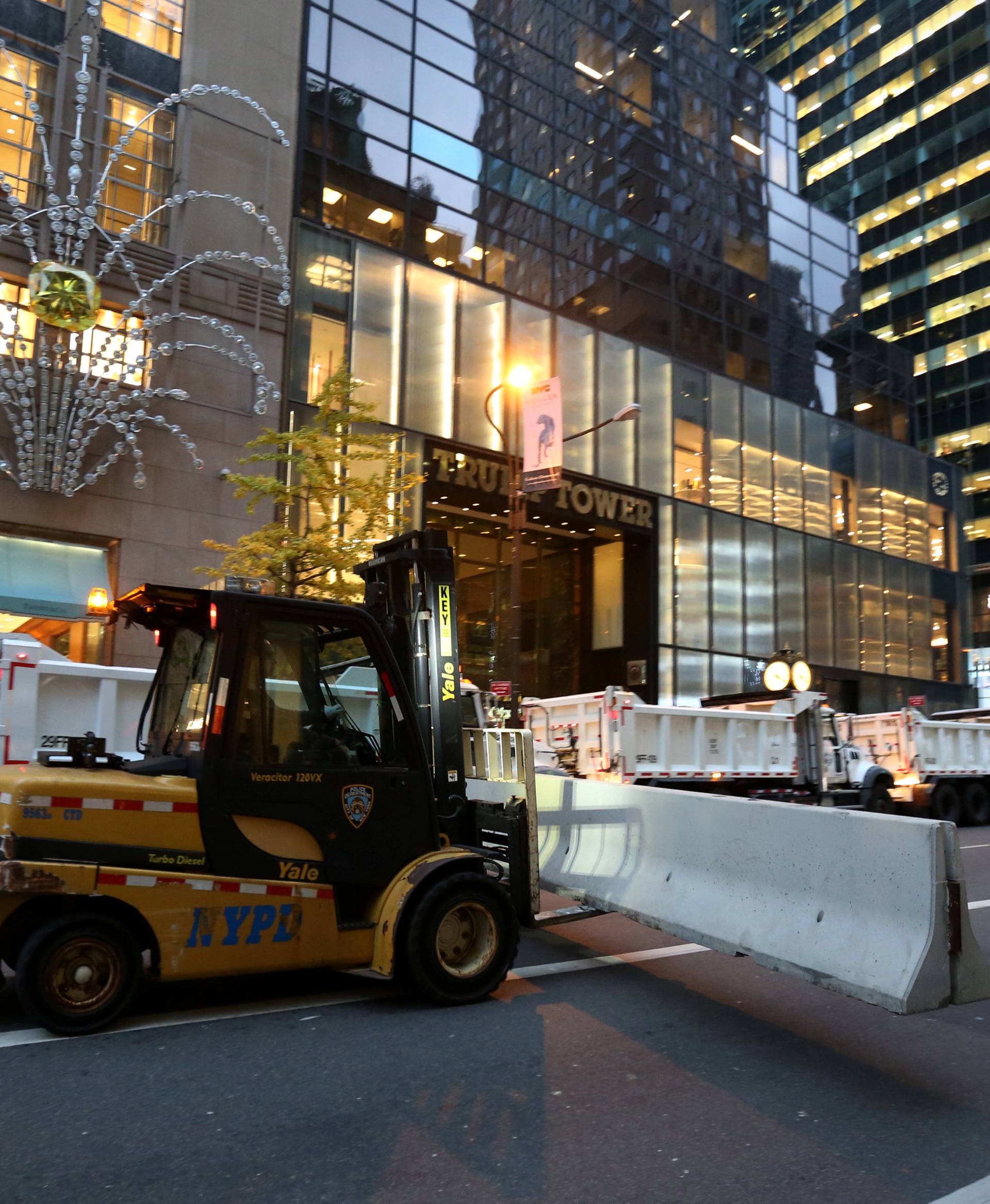 Barricades are brought into position at Trump Tower after the election selected Republican president-elect Donald Trump in New York