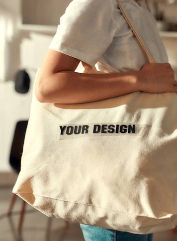 Cropped,Shot,Of,Female,Worker,Posing,With,Custom,Shopper,Bag