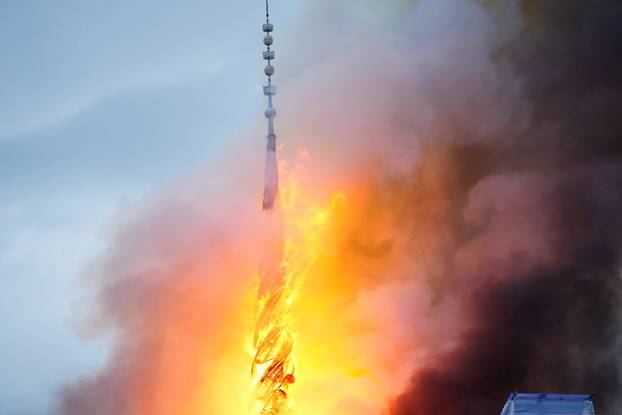 A view of the Old Stock Exchange's "twisted dragons on spire" during a fire at the Boersen, in Copenhagen