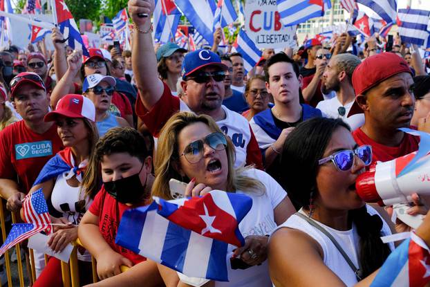 Emigres react to reports of protests in Cuba against its deteriorating economy, in Miami, Florida