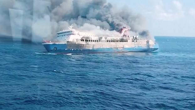 Plumes of smoke rise from a ferry which caught fire off Indonesia's Madura island
