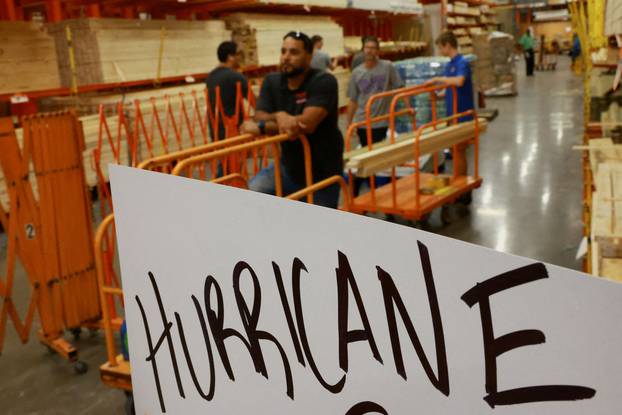 People prepare for the arrival of Hurricane Milton in Orlando