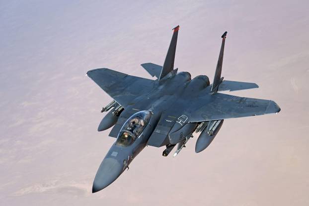 A U.S. Air Force F-15E Strike Eagle conducts a combat air patrol in support of Operation Inherent Resolve over the U.S. Central Command area of respon