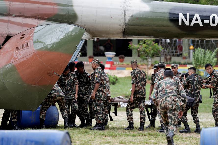 A survivor is airlifted following a flash flood at Trishuli, Nepal