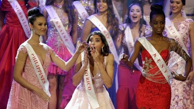 Miss Puerto Rico Stephanie Del Valle reacts to being named Miss World as Miss Philippines Catriona Elisa Gray (L) and Miss Kenya Evelyn Njambi Thungu watch during in the Miss World 2016 Competition in Oxen Hill