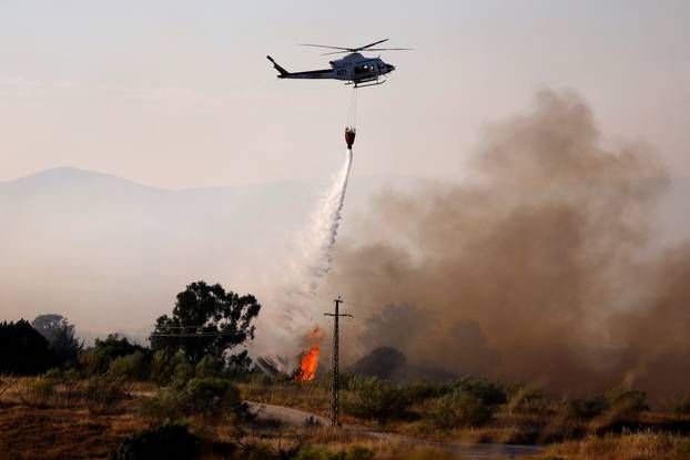 A wildfire burns on the outskirts of Valmojado