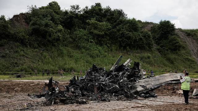 Burnt wreckage of crashed aircraft, in Kathmandu