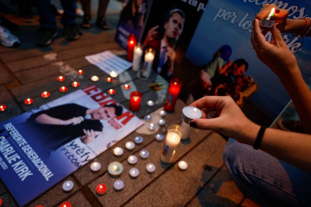 People mourn Charlie Kirk outside the U.S. embassy in Madrid