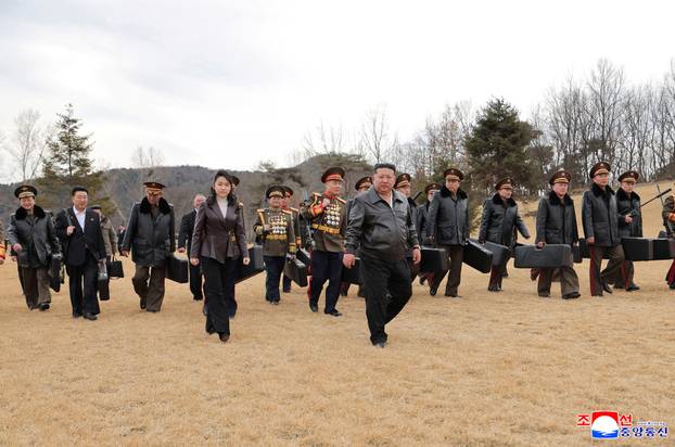 North Korean leader Kim Jong Un sits as he meets with leading officials and military commanders in Pyongyang