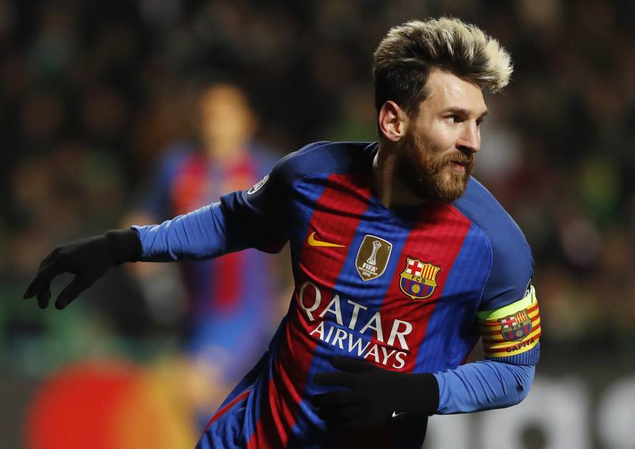 Barcelona's Lionel Messi celebrates scoring their first goal
