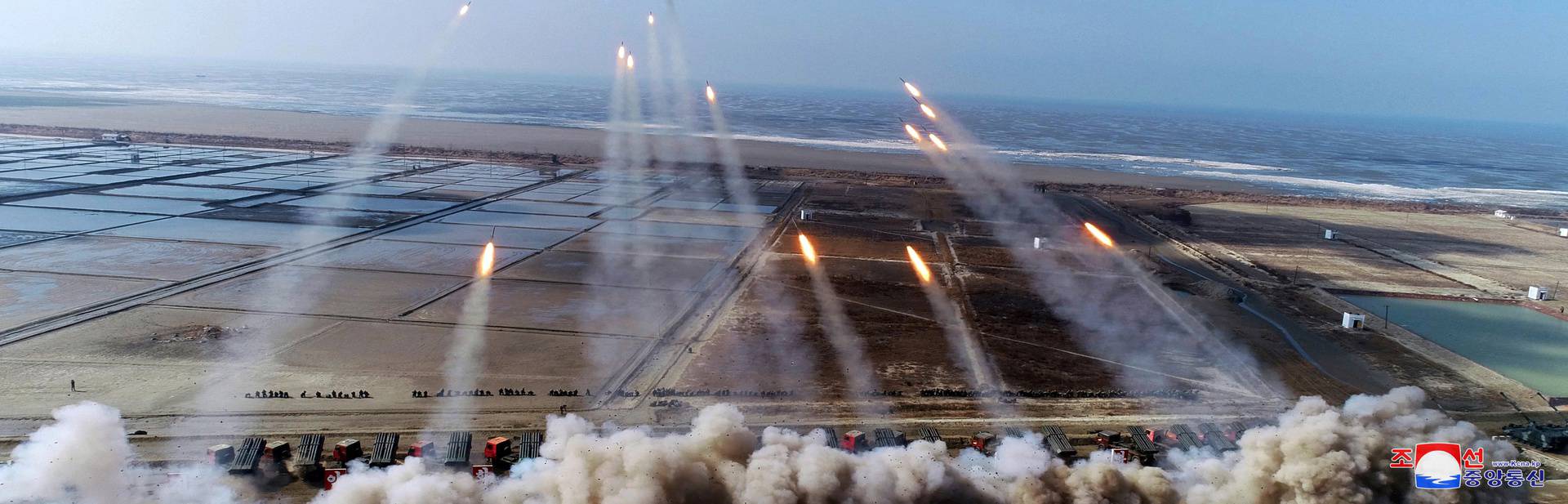 North Korean leader Kim Jong Un guides an artillery firing drill by the Korean People's Army