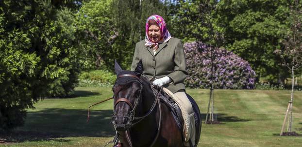 Britain's Queen Elizabeth II rides Balmoral Fern, a 14-year-old Fell pony, in Windsor Home Park