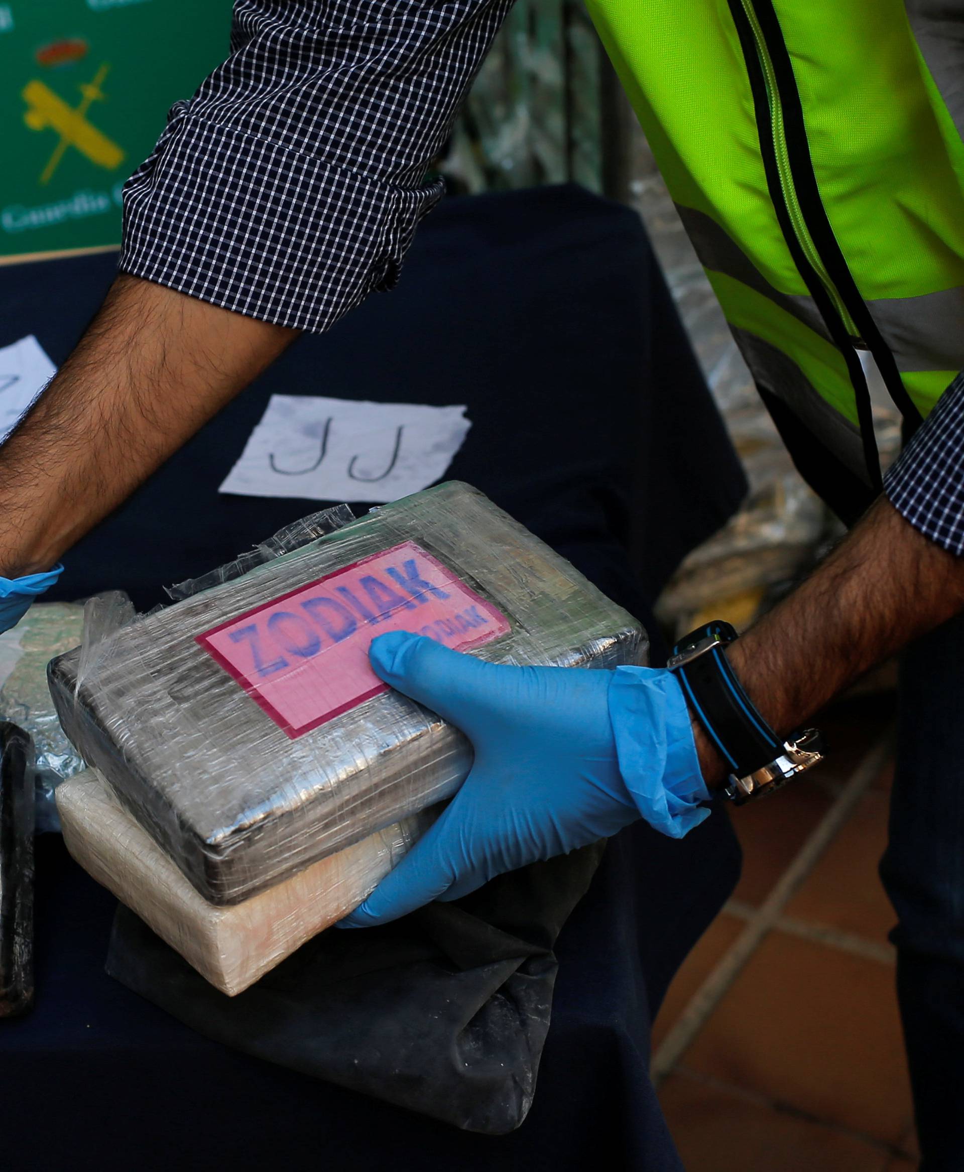 Police display a portion of the more than six tonnes of cocaine hidden among bunches of bananas which officials siezed at an industrial estate at the police headquarters in Malaga