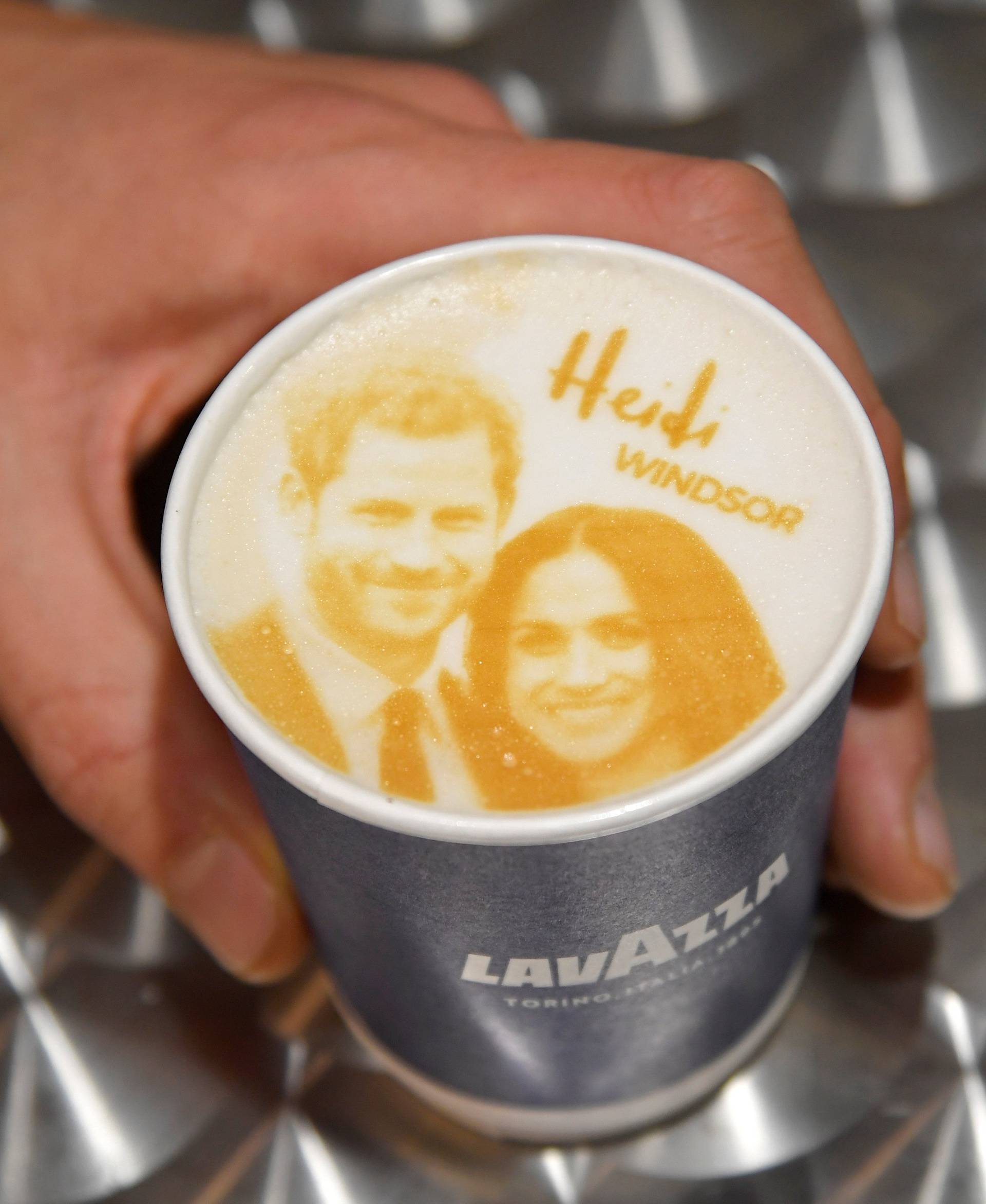 An image of Britain's Prince Harry and his fiancee Meghan Markle is seen on top of a cup of coffee being sold ahead of their forthcoming wedding in Windsor, Britain