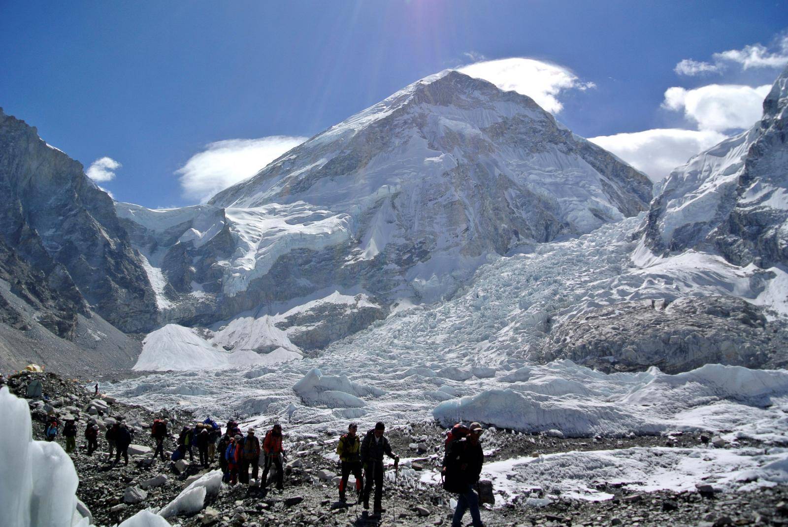 FILE PHOTO: Climbers walk towards their helicopter after their Mount Everest expeditions were cancelled