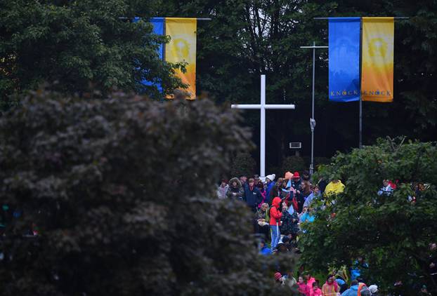 The faithful wait ahead of a visit of Pope Francis to Knock Shrine in Knock