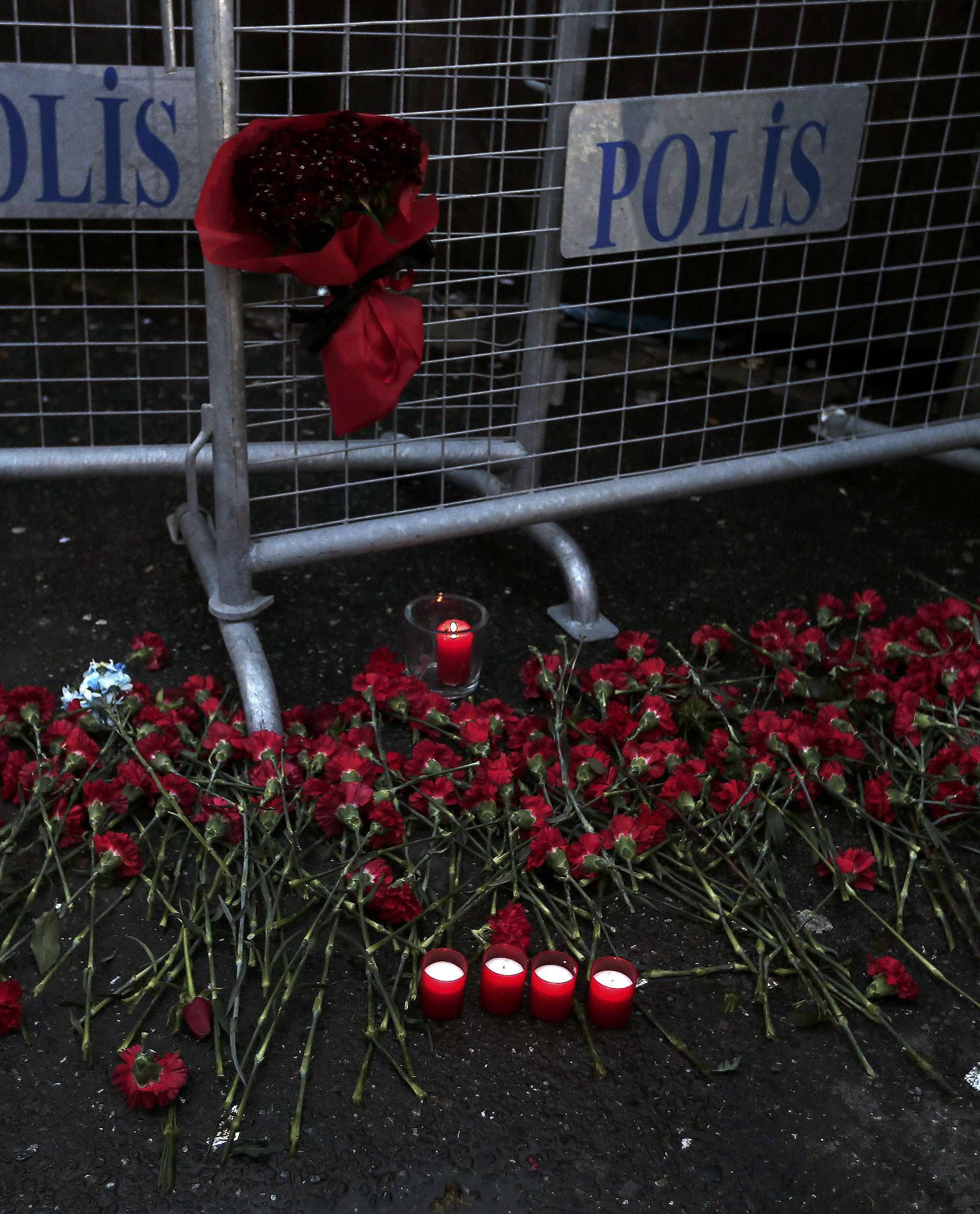 Flowers are placed near the entrance of Reina nightclub by the Bosphorus, which was attacked by a gunman, in Istanbul