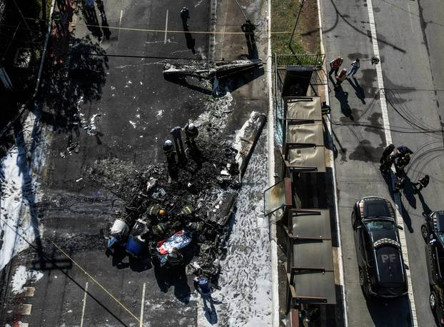 Small plane crashes into vehicles on busy Sao Paulo avenue