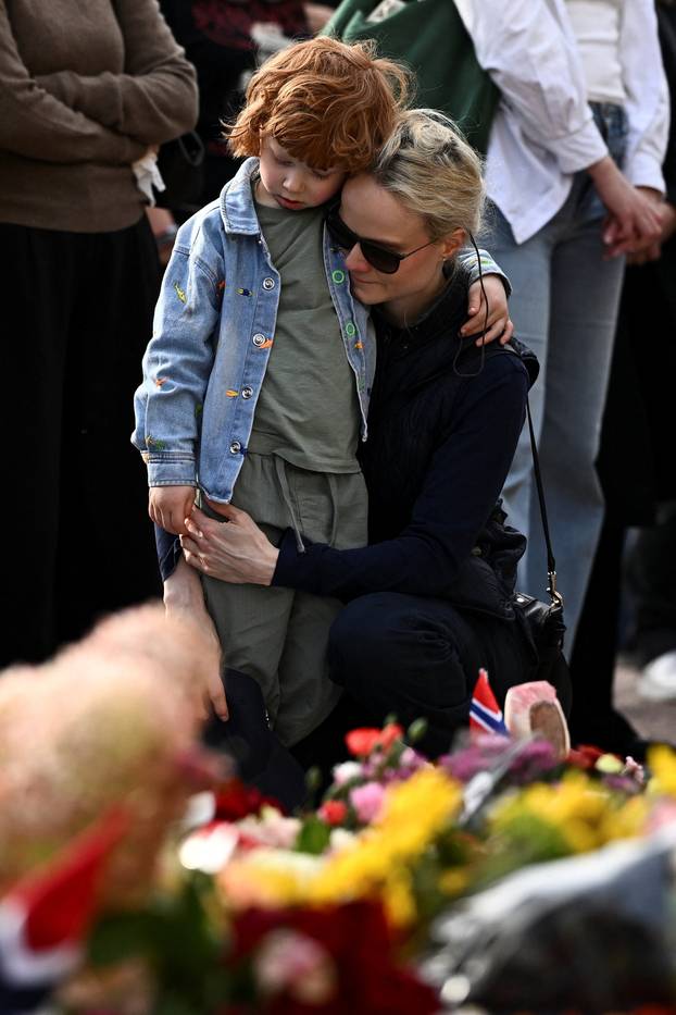 People gather outside the Royal Palace, following the death of Norway's King Harald, in Oslo