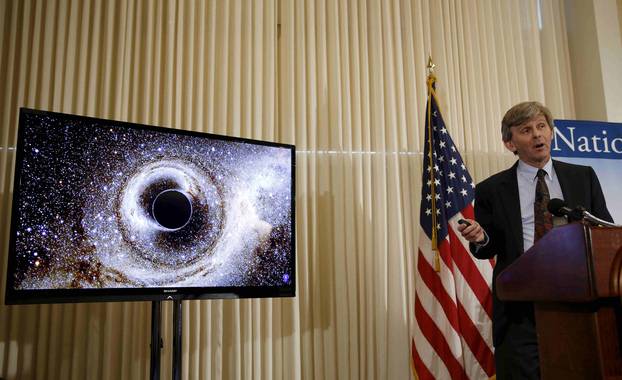 Dr. David Reitze shows the merging of two black holes at a news conference to discuss the detection of gravitational waves in Washington