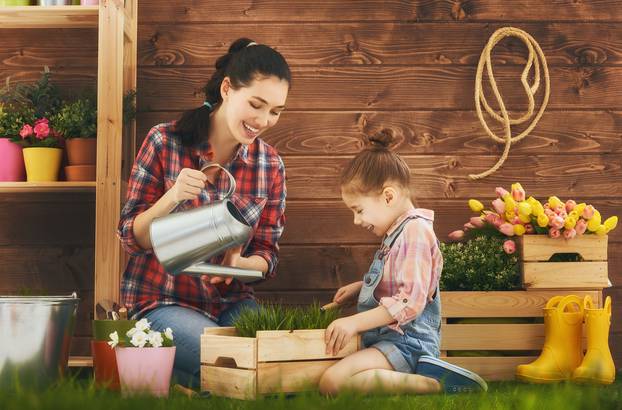 girl helps her mother