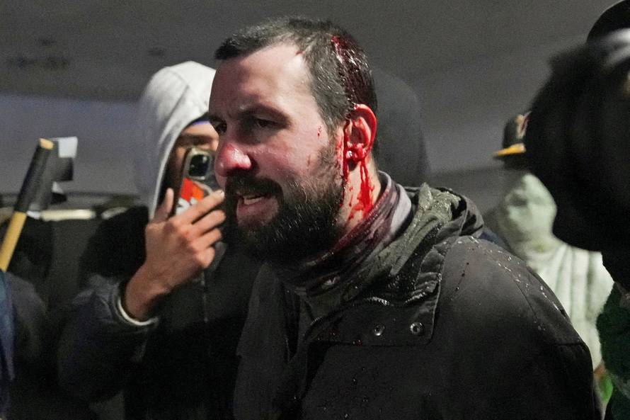 People attend the "March Against Minnesota Fraud" in Minneapolis